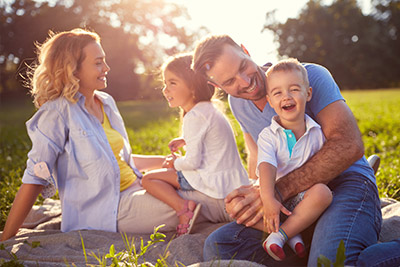 Family sitting in a park