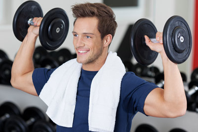 man lifting weights in an overhead press