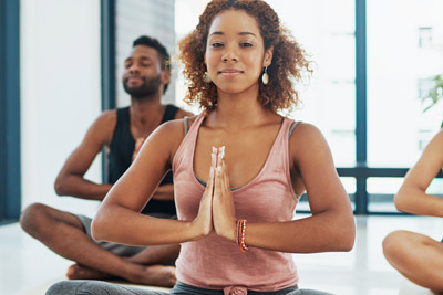 group of people taking a yoga class