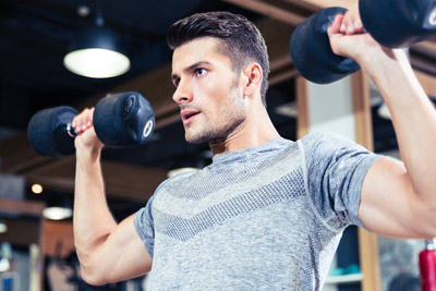 Man doing a seated dumbbell press